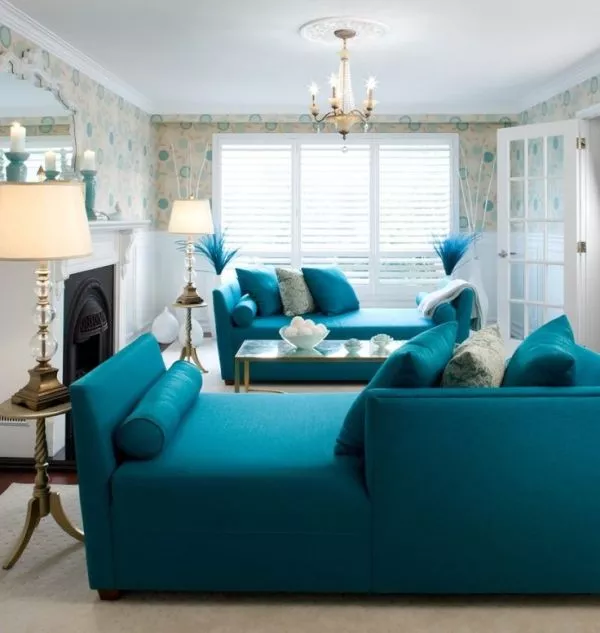living room with bright teal sofas